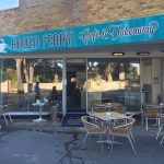 Haven Ferry Café & Takeaway with outdoor seating offering breakfast baps, sandwiches, and hot drinks in a cosy setting