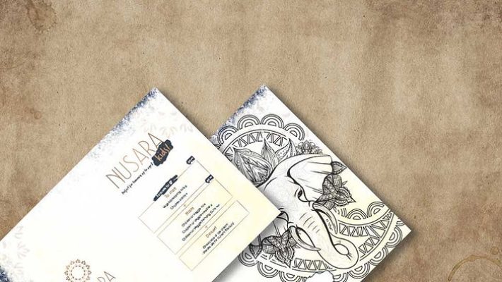Elegant brochure design showcasing intricate elephant artwork and detailed information on a textured background