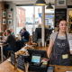Busy cafe interior with staff serving customers, showcasing delicious pastries and local food menu, No.32 Poole